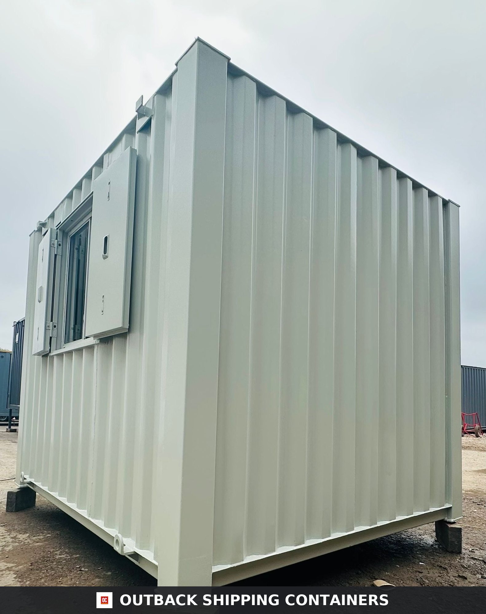 10x8 ft 10X8FT for Sale — Door and Entry Detail | Outback Shipping Containers Refurbished 10x8 portable office unit with anti-vandal steel shutters and light gray corrugated siding
