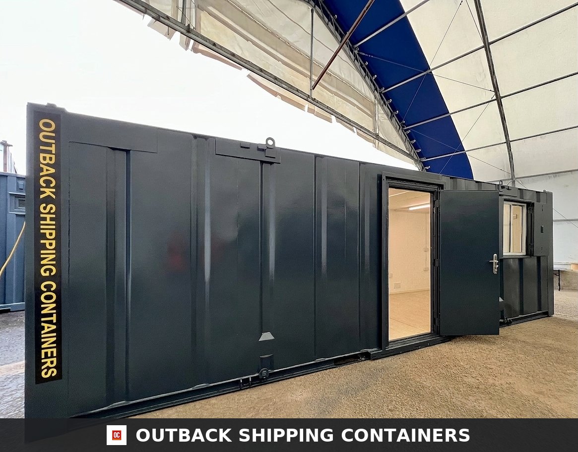 Exterior view of a dark grey 24x9 ft shipping container office with open steel door and small window