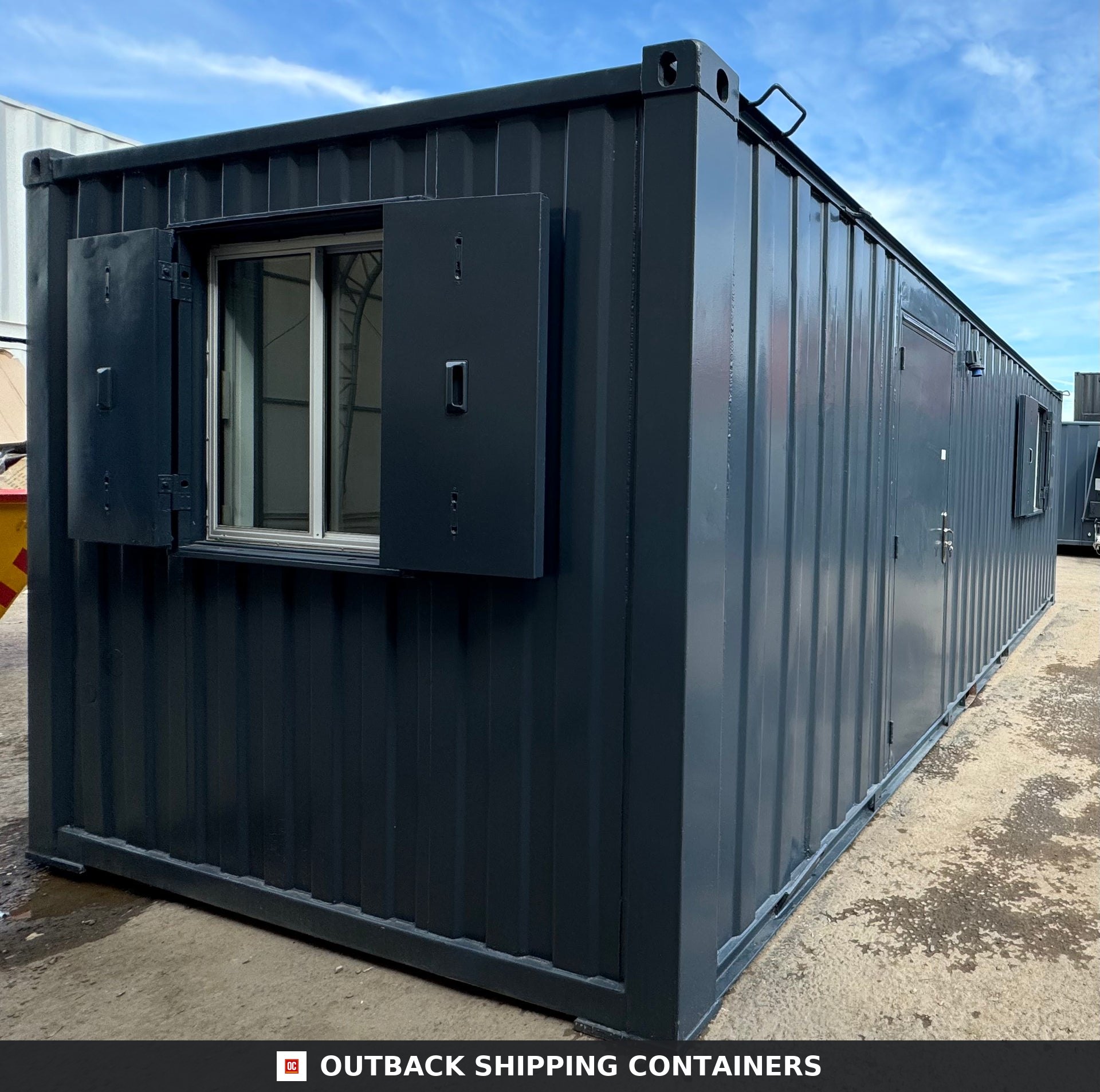 24x9 ft 24x9FT for Sale — Interior Detail | Outback Shipping Containers Refurbished 24x9 ft anti-vandal shipping container office with open steel window shutters and a side entrance door