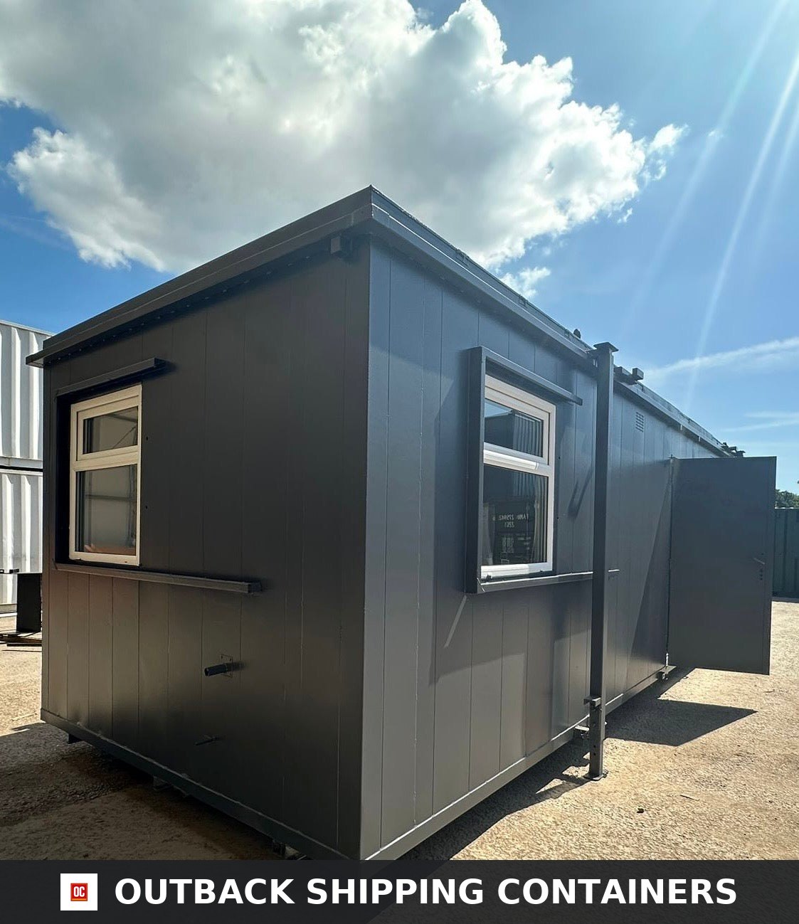 32 x 10Ft 32x10FT for Sale — Interior View | Outback Shipping Containers Refurbished 32ft shipping container office exterior with charcoal grey siding, white windows, and open door