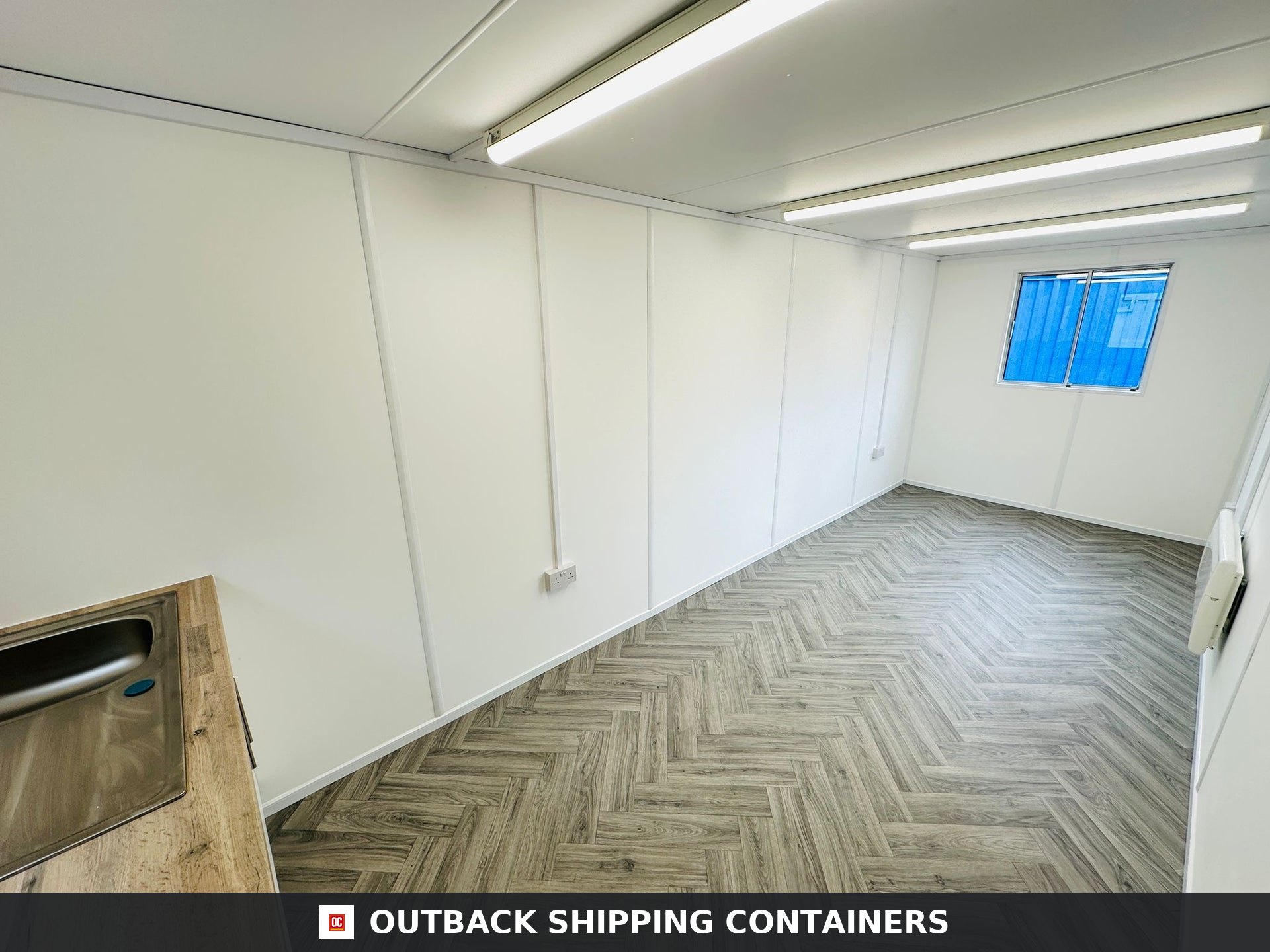 21x8ft for Sale — Rear Exterior View | Outback Shipping Containers 21x8ft grey anti-vandal shipping container office with steel door and shuttered window