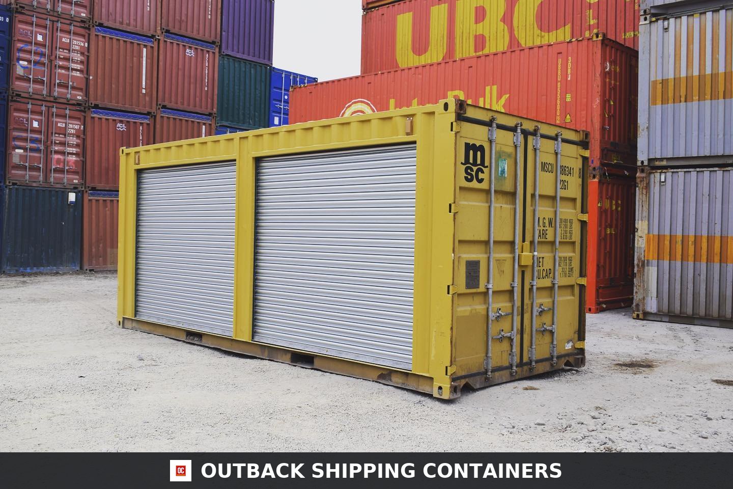 Yellow 20ft Used Container for Sale — Three-Quarter Angle View | Outback Shipping Containers Yellow 20ft shipping container with two silver roll-up doors on the side panel in a cargo yard