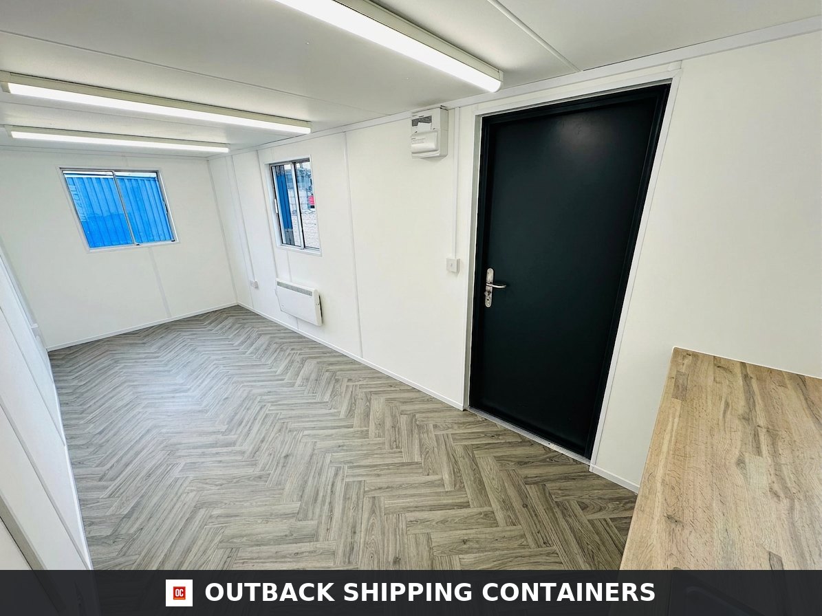 21x8ft for Sale — Side Profile View | Outback Shipping Containers Refurbished anti-vandal office container interior with herringbone vinyl flooring, white walls, and a black steel door