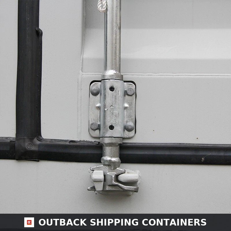 Close-up of a galvanized steel locking rod and cam on a 40ft white shipping container door with black rubber seals