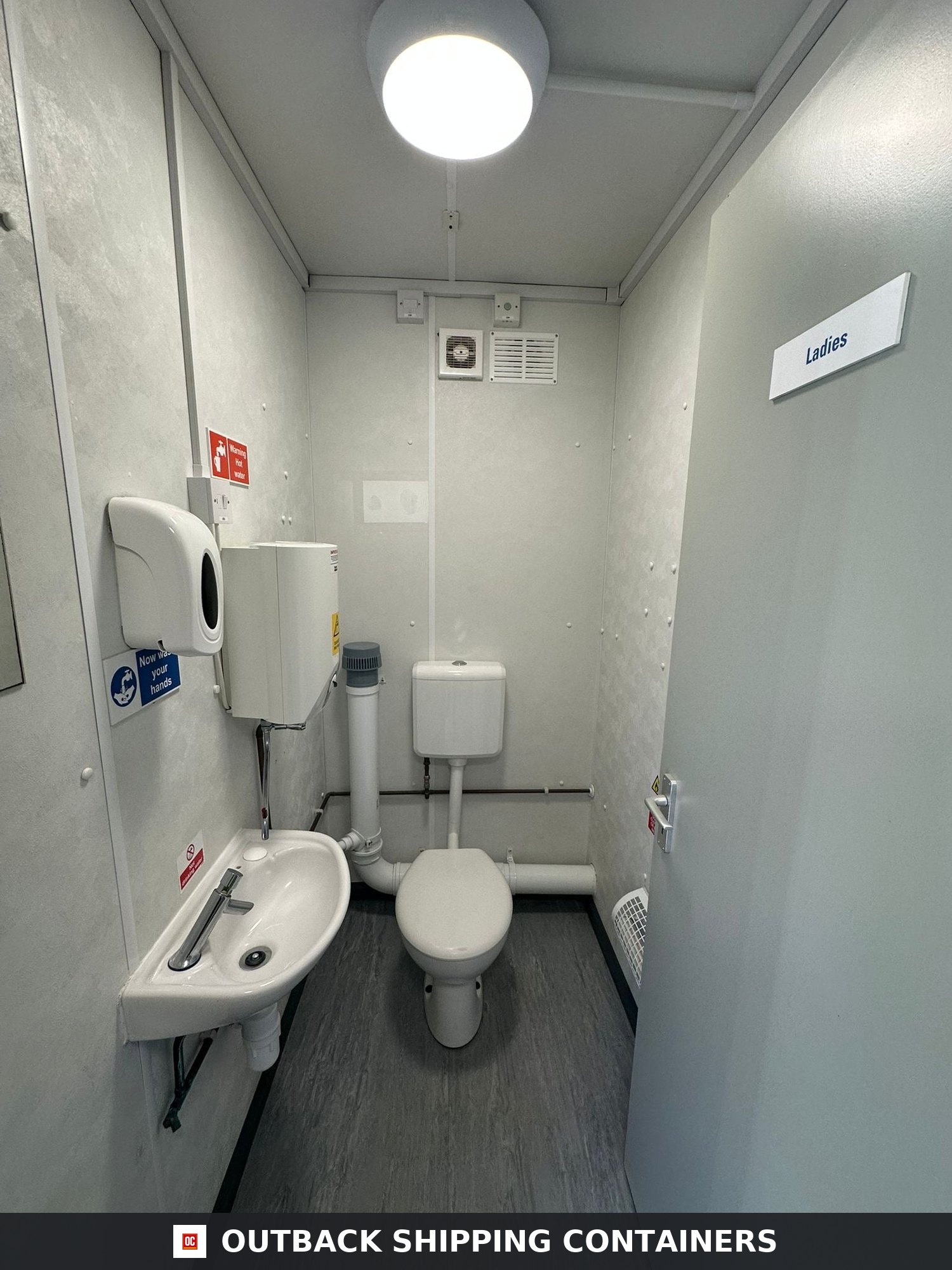 32 x 10Ft 32x10FT for Sale — Corner Casting and Frame Detail | Outback Shipping Containers Interior view of a ladies restroom in a 32 foot refurbished shipping container with toilet and hand wash basin