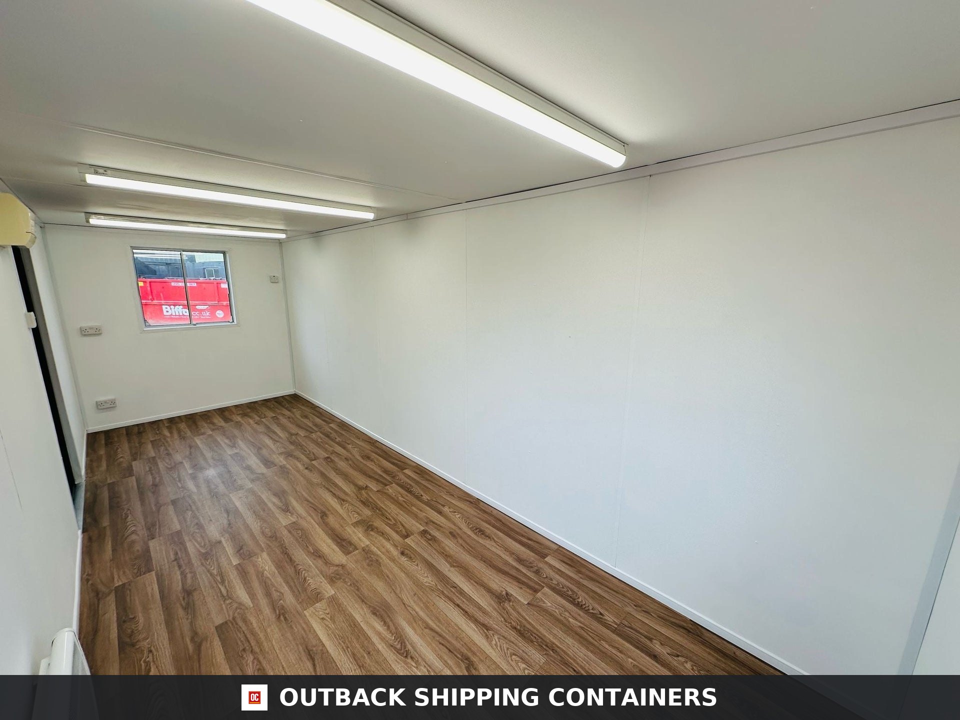 21x8ft for Sale — Interior Detail | Outback Shipping Containers 2 3 4 5 Interior view of a 21x8 refurbished shipping container office with white walls and wood grain vinyl flooring