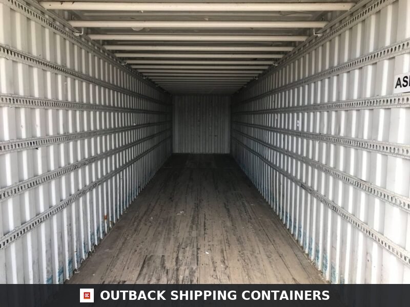 45ft Used Shipping Containers for Sale — Three-Quarter Angle View | Outback Shipping Containers Interior view of a 45ft used shipping container showing wooden floors and white corrugated metal walls with logistics tracks