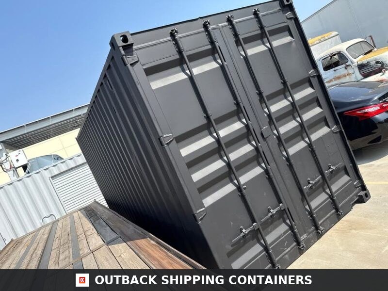 20ft Used Shipping Container for Sale — Rear Exterior View | Outback Shipping Containers 2 3 15 Rear view of a matte black 20ft shipping container showing locking cargo doors and vertical bars