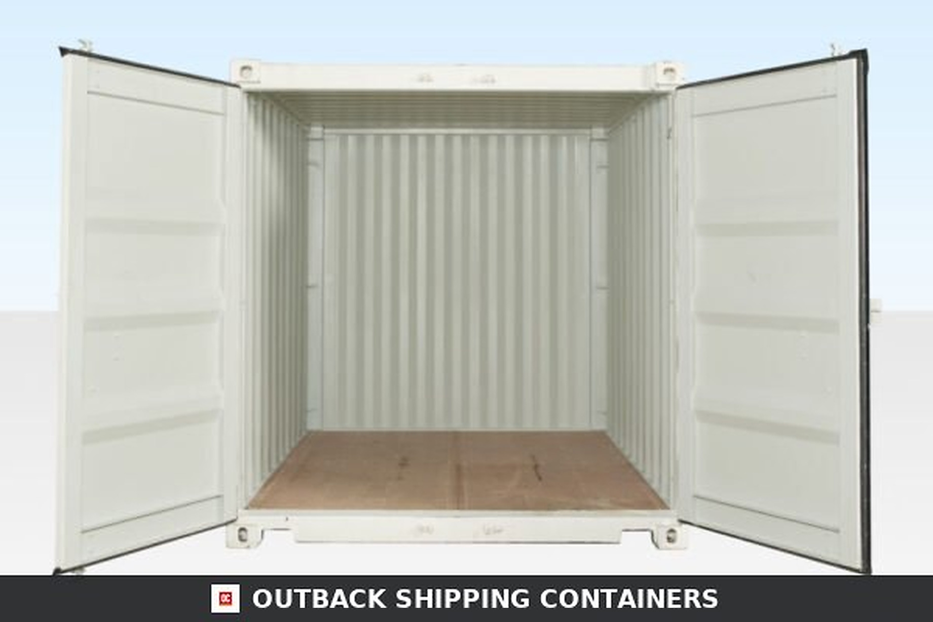 Interior view of an open 10ft white shipping container with nautical wood flooring and steel walls