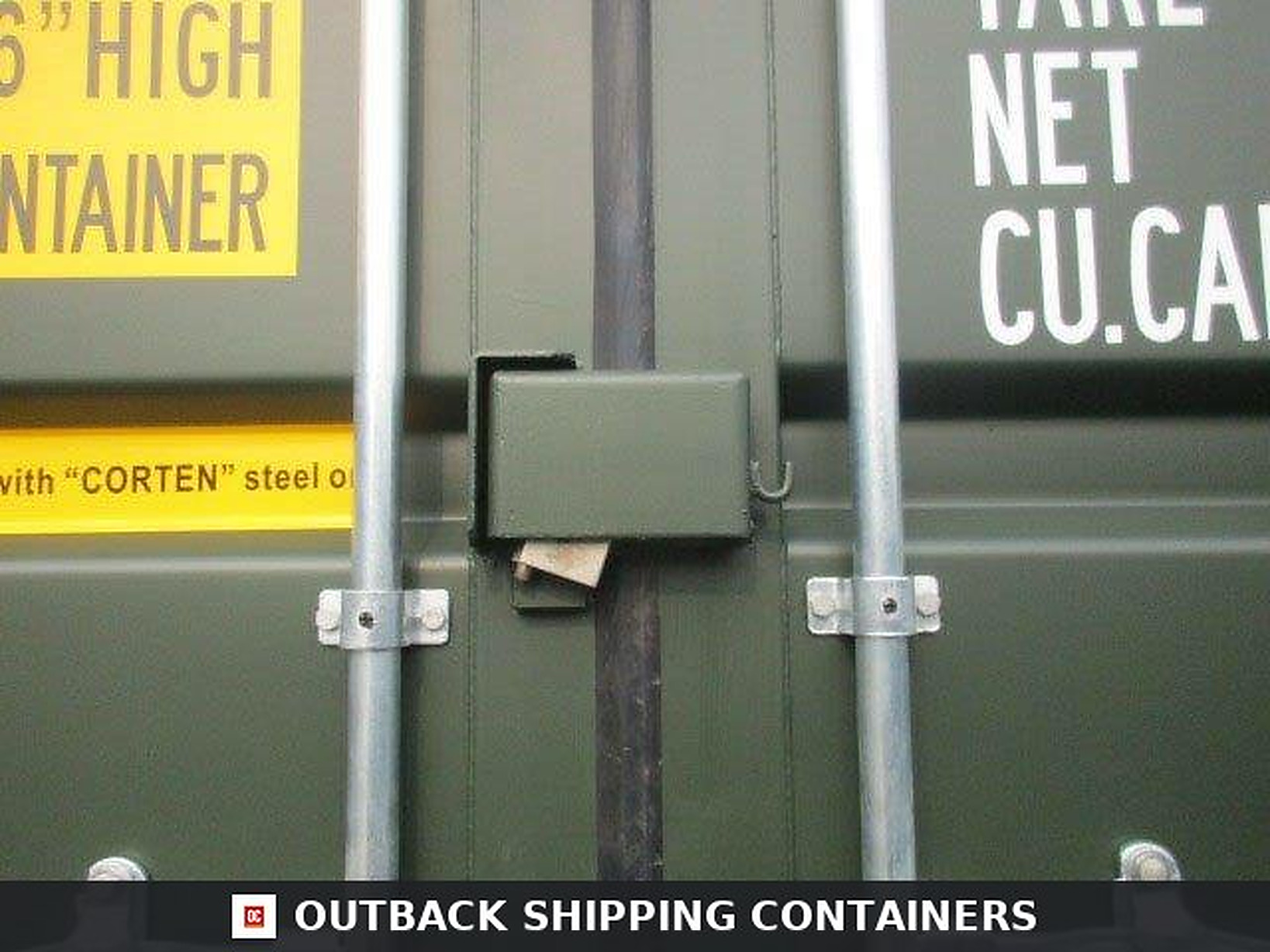 40 Ft New Shipping Containers Ready To Ship 40ft for Sale — Door and Entry Detail Close up of a lock box on a green 40ft new shipping container door with vertical galvanized bars