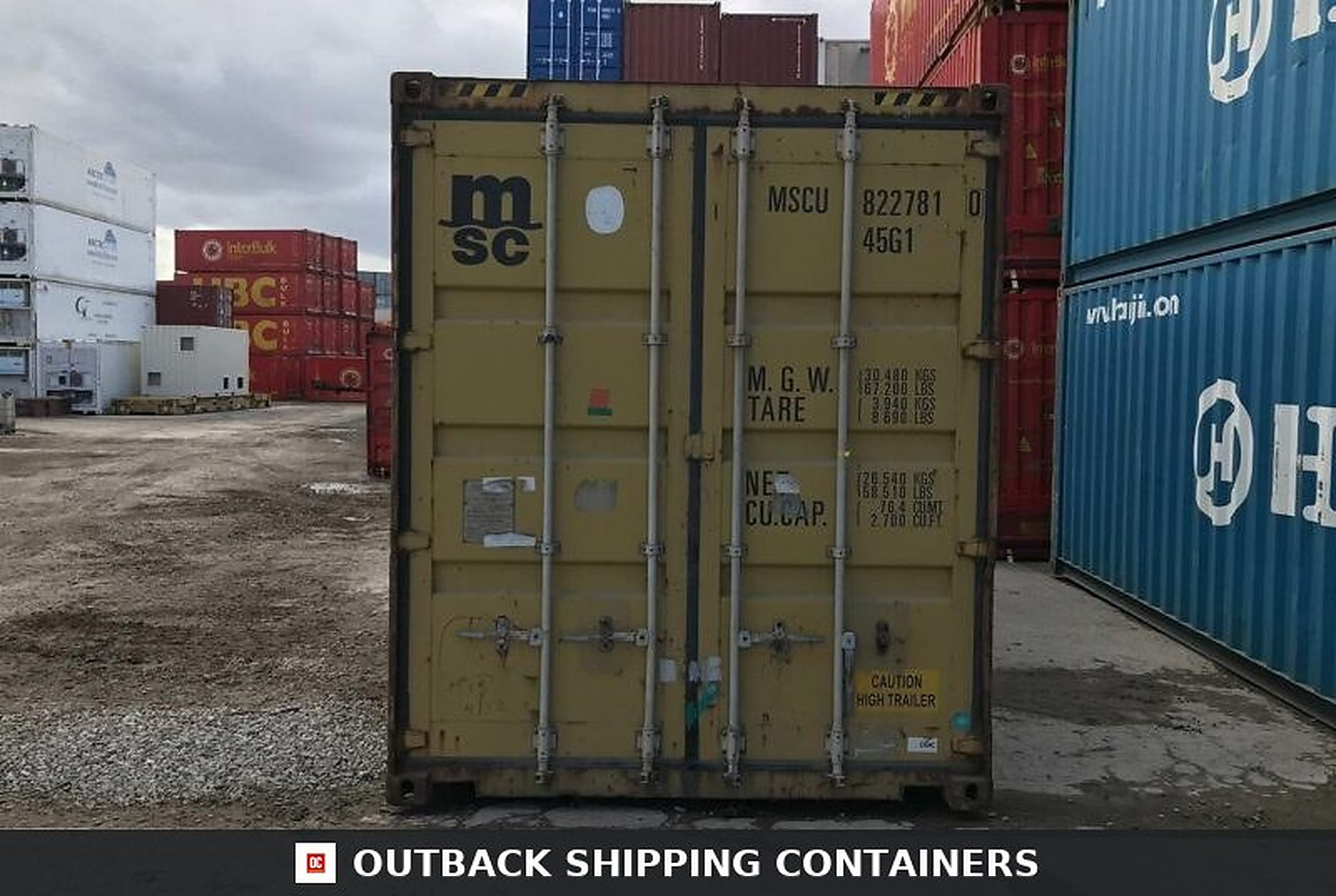 40ft used storage container rear doors showing vertical locking bars and technical specifications in a cargo yard