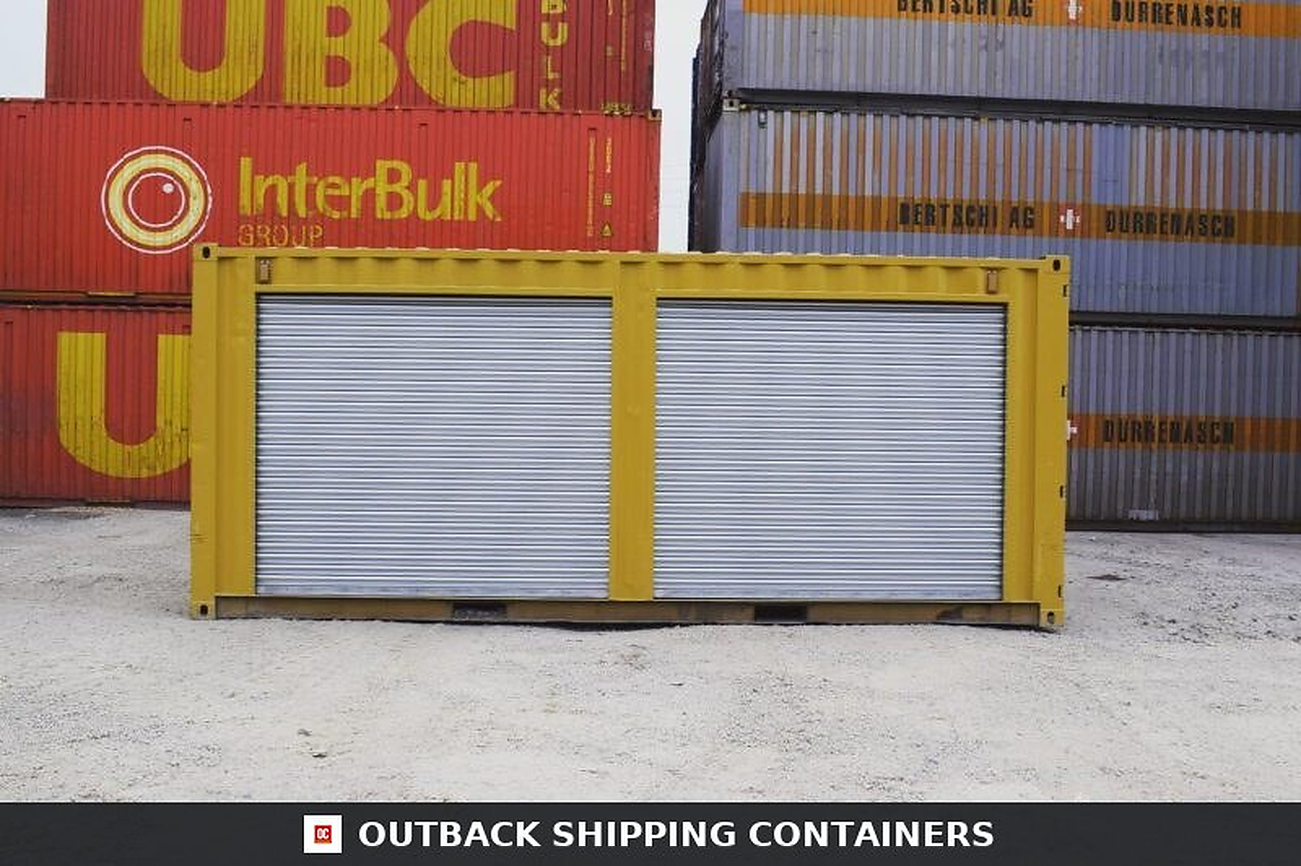 Yellow 20ft Used Container – Dual Side Roll-Up Doors Yellow 20ft used shipping container featuring two silver roll-up doors on the side panel in a shipping yard