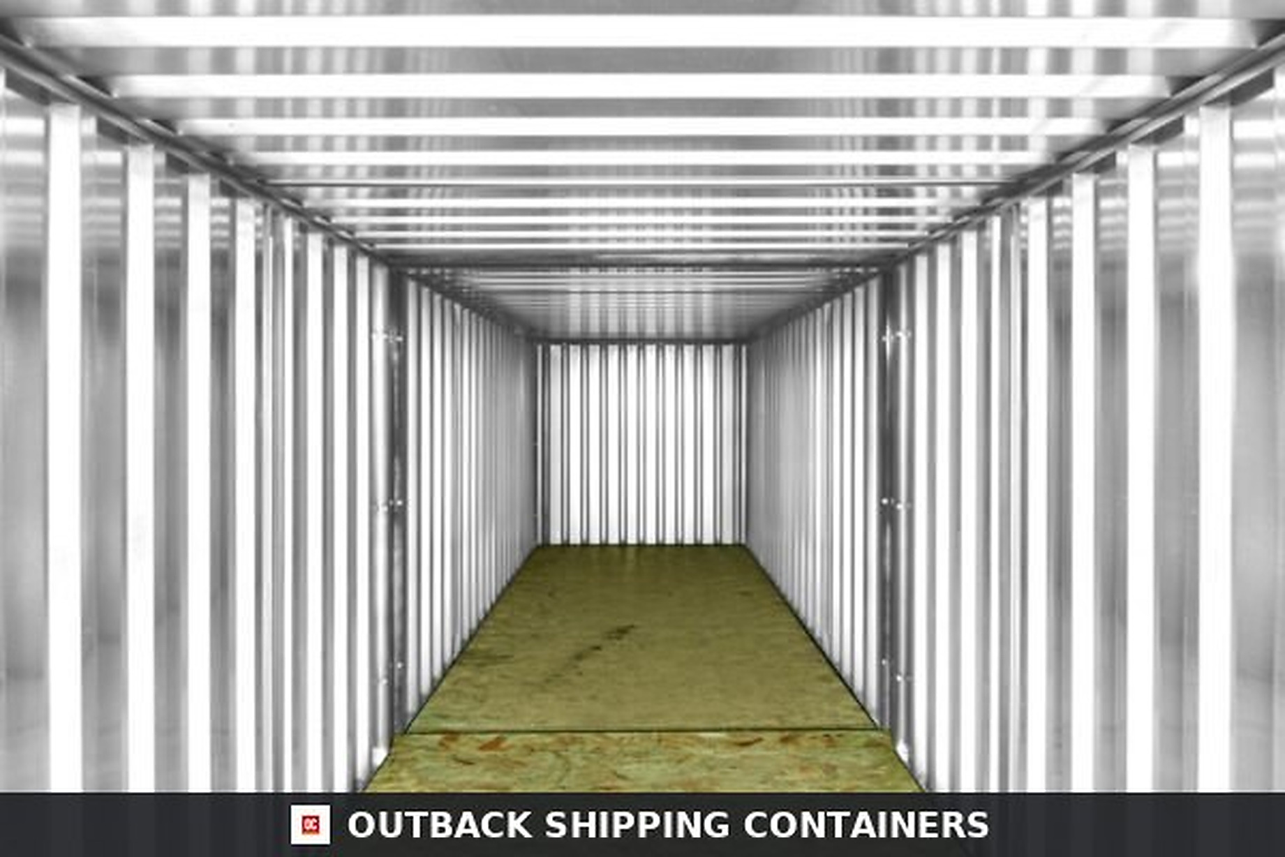 Interior view of an empty 6M end linked flat packed container with corrugated metal walls and wood flooring