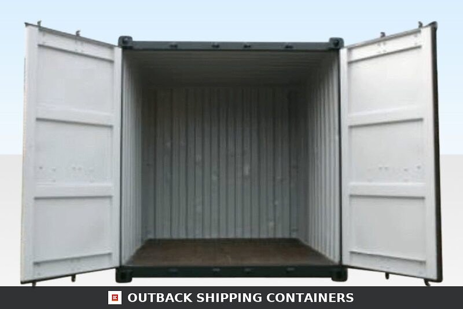 Interior view of an open 10ft used shipping container with corrugated steel walls and wood flooring