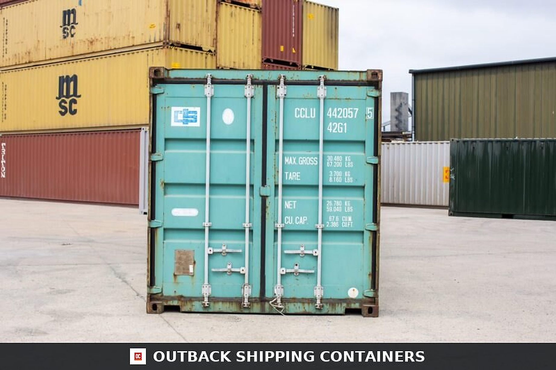 Rear cargo doors of a teal 40ft preloved shipping container in a storage yard with locking rods and handles visible